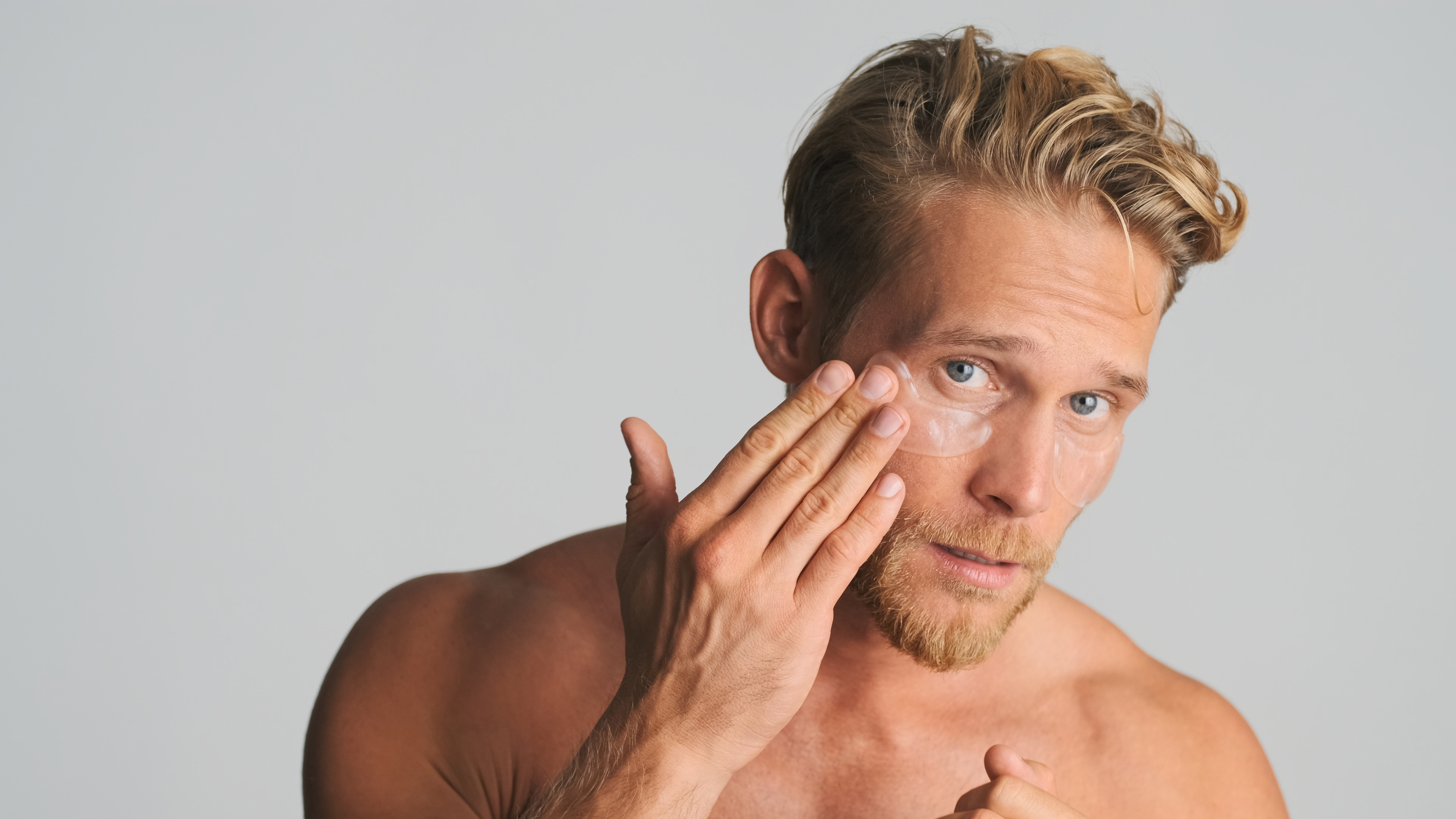handsome-blond-bearded-man-applying-eye-patches-take-care-his-skin-isolated-white-background.jpg (2.09 MB)